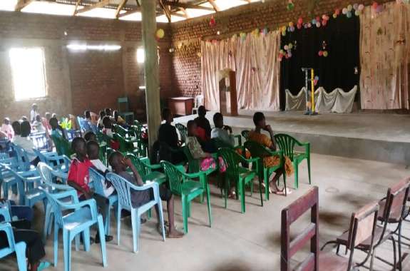 A church support project handing over practical items